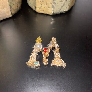 Elegant Gold and Pearl “M” Brooch